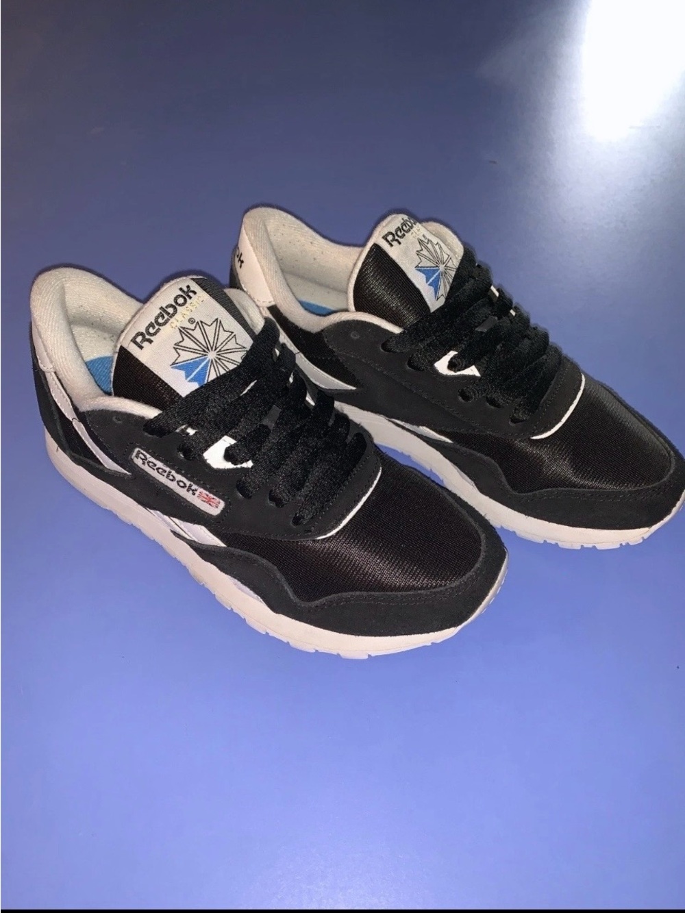 Reebok Women's Black & White Low-Top Sneakers with Blue Accents